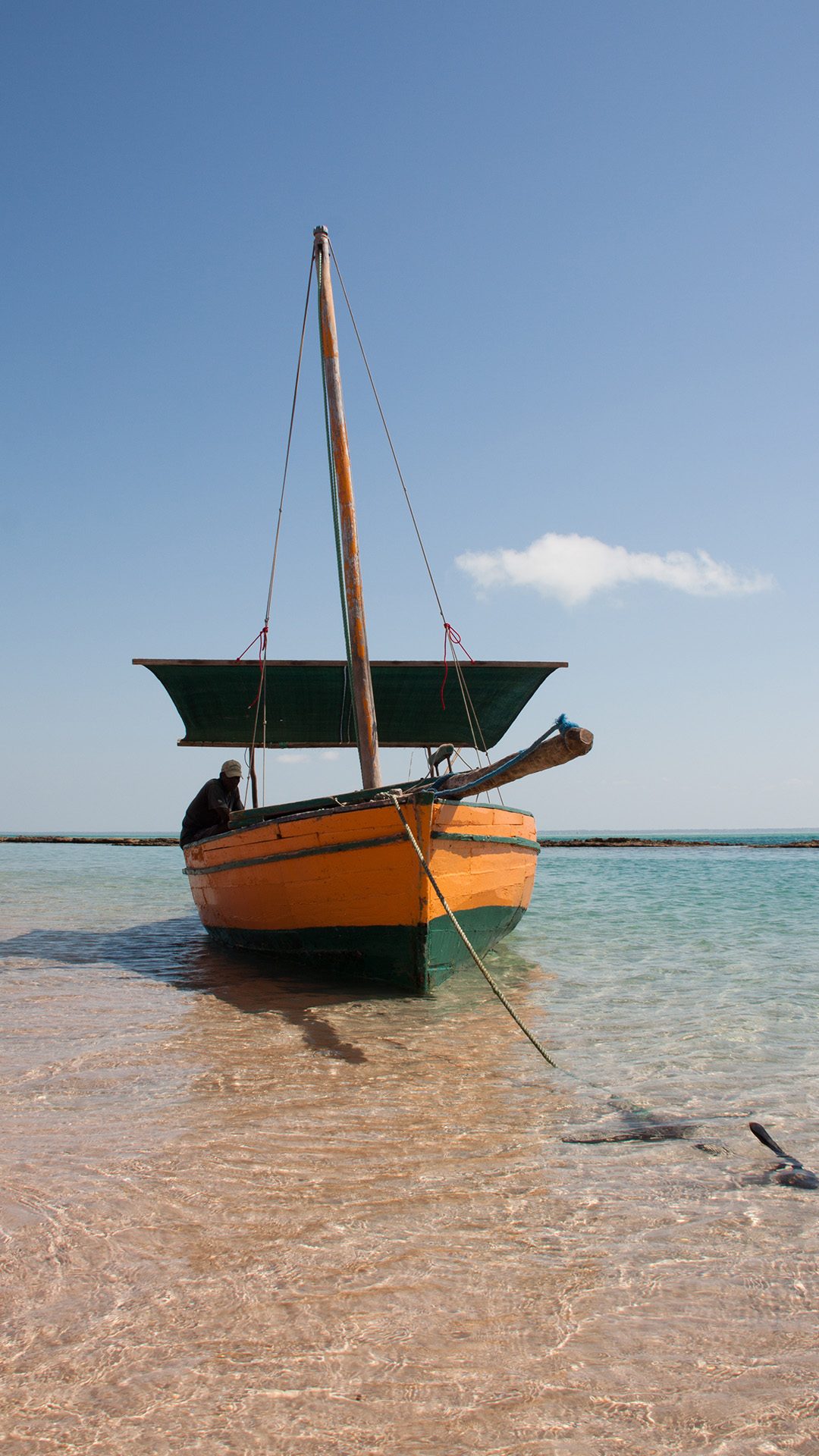 Traditional dhow sailing turquoise waters Bazaruto Archipelago
